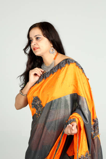 istock Indian woman posing on off white background 1212666775