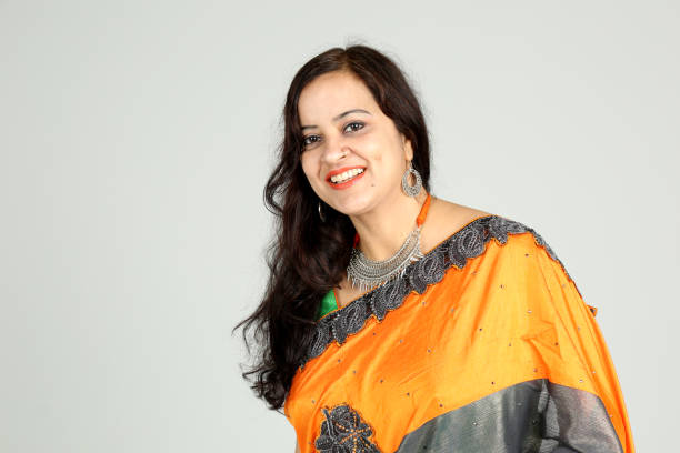istock Indian woman posing on off white background 1212666927