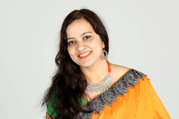istock Indian woman posing on off white background 1212667119