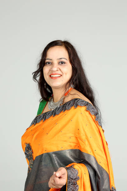istock Indian woman posing on off white background 1212667648