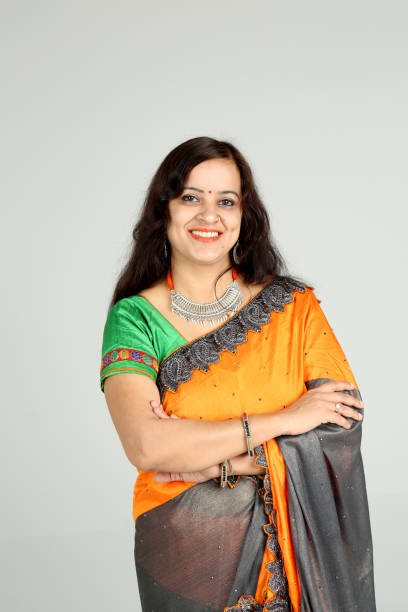 istock Indian woman posing on off white background 1212667669