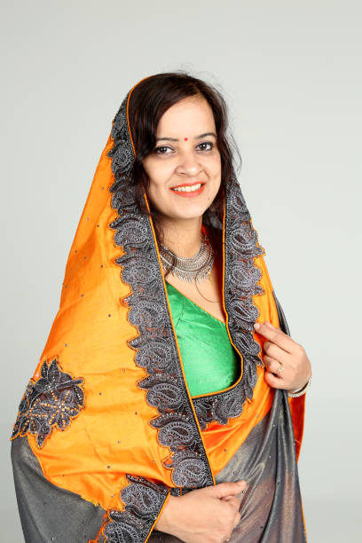 istock Indian woman posing on off white background 1212667906
