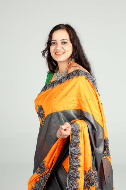 istock Indian woman posing on off white background 1212668016