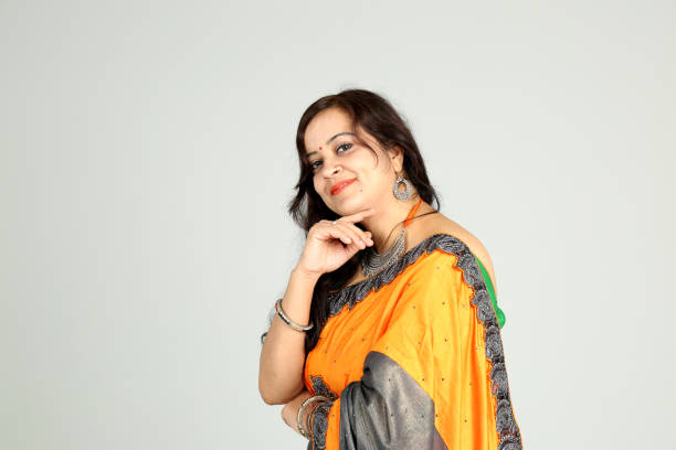 istock Indian woman posing on off white background 1212668086