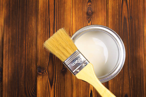 istock House renovation, paint can on the old wooden background with copy space 1212668099