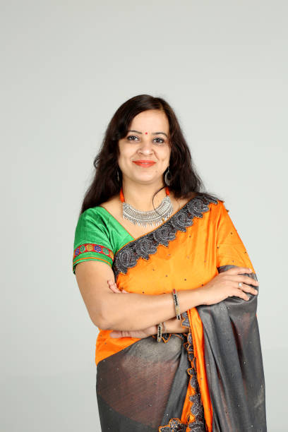 istock Indian woman posing on off white background 1212668738