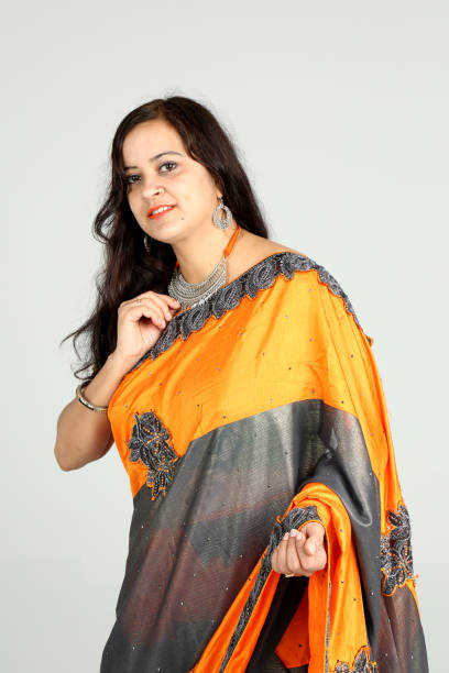 istock Indian woman posing on off white background 1212668776