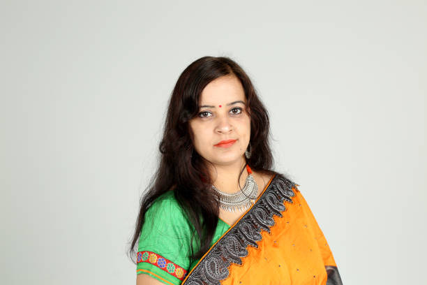 istock Indian woman posing on off white background 1212668809