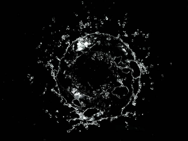 Abstract twister shape of water splash, isolated on black background. Freeze motion, energy and wash concept.