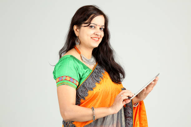 istock Indian woman posing on off white background 1212669701