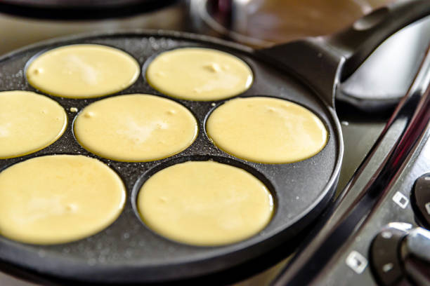 istock pancake frying pan with smile face pancake cooking on cooker in kitchen 1212669953