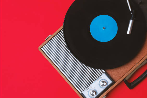 istock Vintage vinyl player and turnable on a red background 1212671074