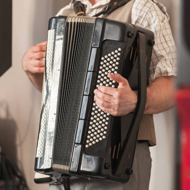 istock Live music background. Accordionist plays 1212671086