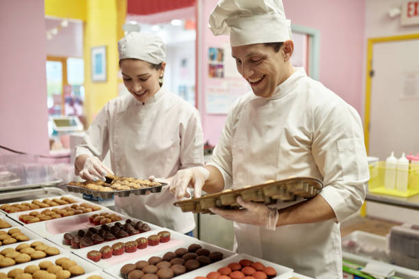 istock Hispanic American Chefs Preparing Cupcakes in Vegan Bakery 1212674702