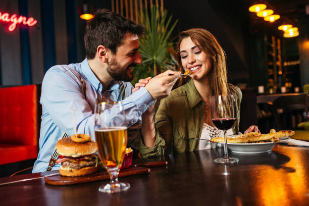 istock Friends enjoying their pizza at the restaurant 1212674851