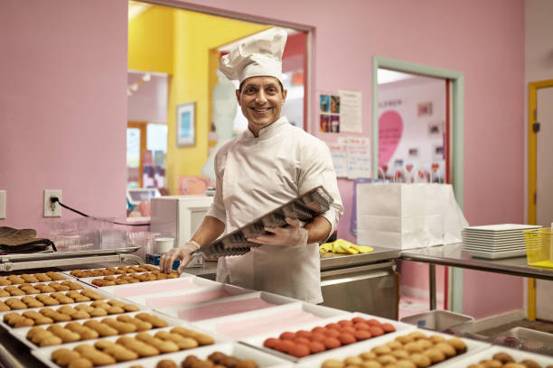 Hispanic American Chef in Late 40s Baking Vegan Cupcakes