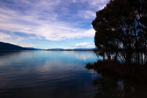 The sun sets across this southern lake creating beautiful colours and reflections