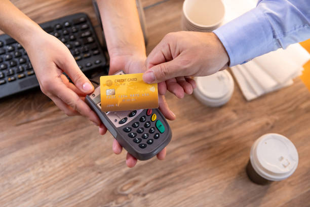 istock Paying a coffee with gold credit card 1212677392