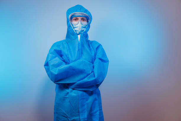 istock Virus. Paramedic in a protective suit against the virus. 1212678027