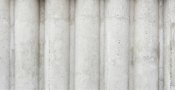 istock gray concrete wall in the form of columns 1212682417