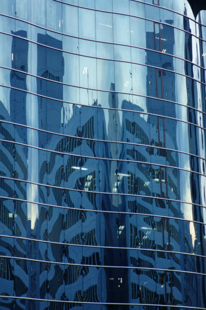 istock Reflection and reflection on the glass wall of the building 1212683461