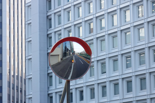 Traffic safety oncoming mirrors standing in urban streets