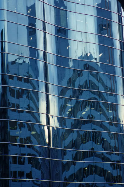 istock Reflection and reflection on the glass wall of the building 1212683481