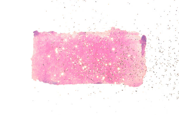 istock Golden glitter on abstract pink watercolor splash on white 1212684862