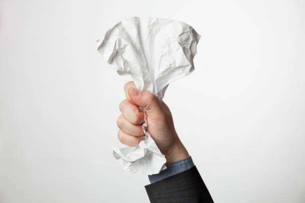 istock Crumpled A4 paper document in businessman hands. Office problems concept 1212687558