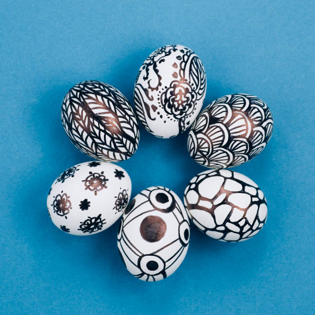 istock Easter eggs are painted black and white, abstraction, laid out in a circle 1212688567