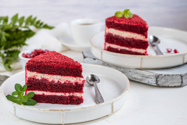 istock Cake Red velvet on two white plates, two servings. On a light background. Birthday, holidays, sweets. 1212689049