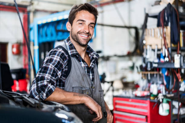 istock Confident mechanic at auto repair shop 1212689557