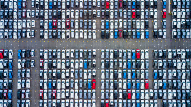 Aerial view new cars parking for sale stock lot row, New cars dealer inventory import export business commercial global, Automobile and automotive industry distribution logistic transport worldwide. Aerial view new cars parking for sale stock lot row, New cars dealer inventory import export business commercial global, Automobile and automotive industry distribution logistic transport worldwide. car plant photos stock pictures, royalty-free photos & images