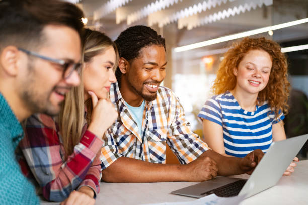 istock Group of business people and software developers working as a team in office 1212692176