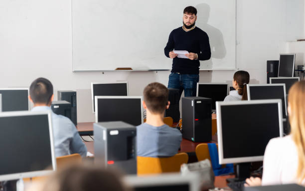 istock Serious teacher gives lecture in the classroom 1212693292