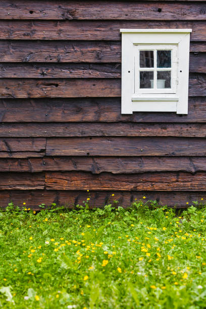 istock Old white window on wooden cottage 1212695101