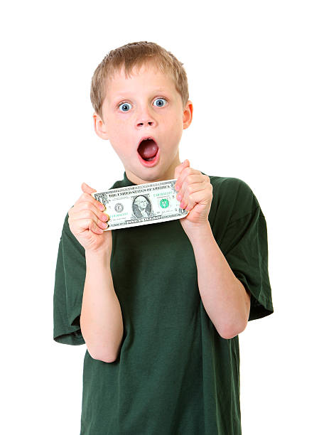 excited boy with a dollar stock photo