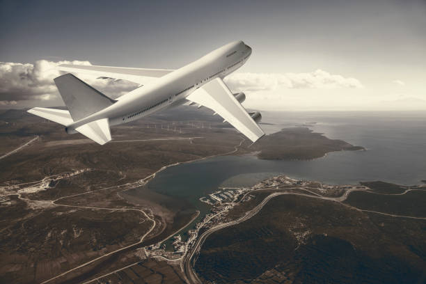 istock airplane flying over a coast city 1212697192