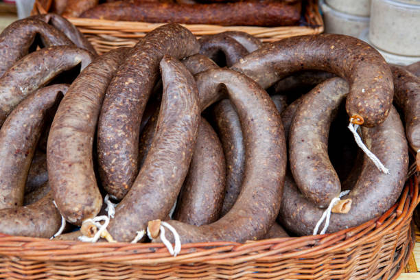 istock Brown and fresh black pudding on the market stall 1212698058