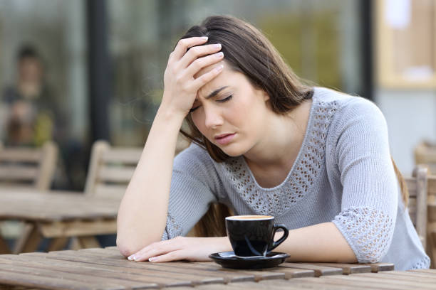 istock Depressed girl complaining on a coffee shop terrace 1212698455