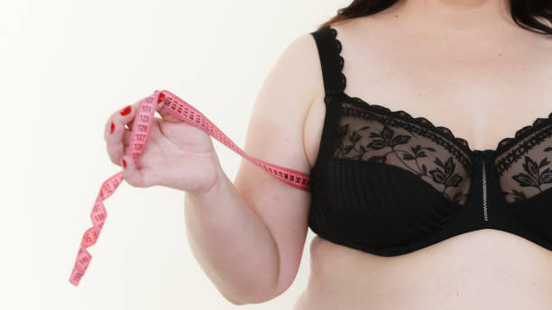 istock Woman measuring her chest breasts bust size 1212700135
