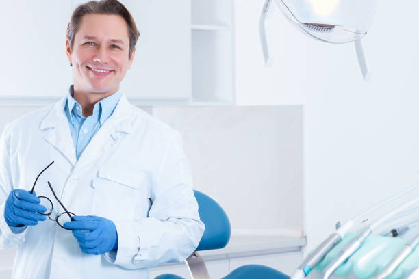 istock Cheerful male man dentist at dentist office 1212701500