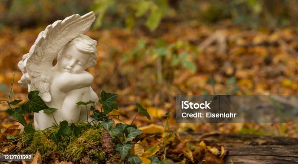 Urn Grave With Angel Forest Cemetery Stock Photo - Download Image Now - Angel, Grief, Crematorium