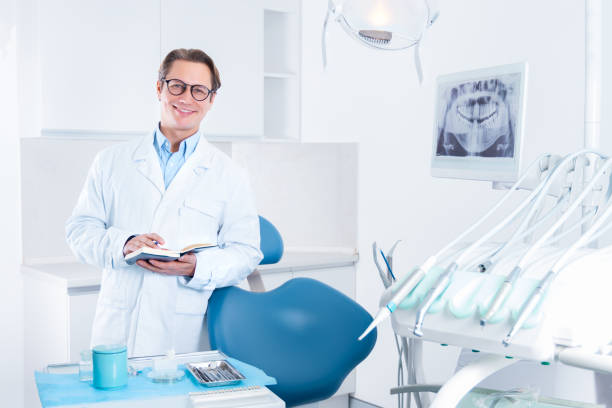 istock Cheerful male man dentist at dentist office 1212701938