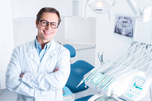 istock Cheerful male man dentist at dentist office 1212702094