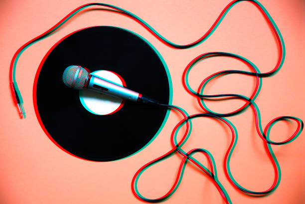 istock Blurred photo. Microphone on record. Retro music. Disco party. 1212702271