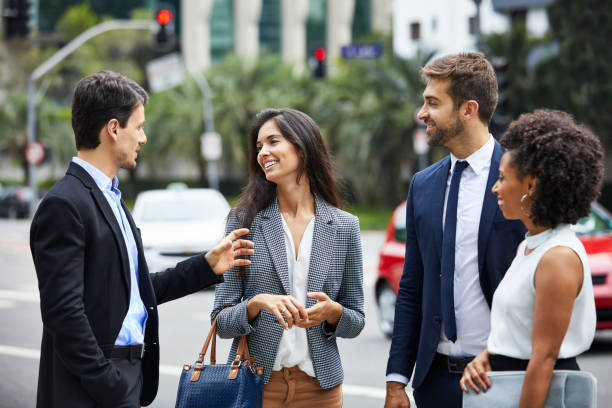 istock Businessman with colleagues discussing in city 1212703637