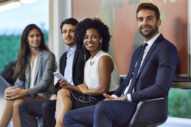 istock Entrepreneurs sitting at railroad station platform 1212703786