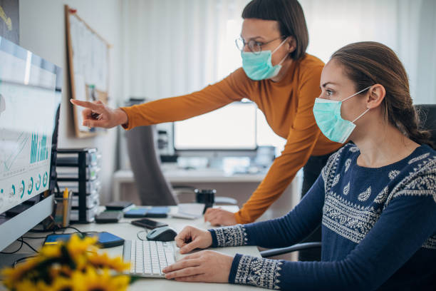 istock Colleagues at work wearing face protective mask, to protecting themselves against corona virus 1212707751