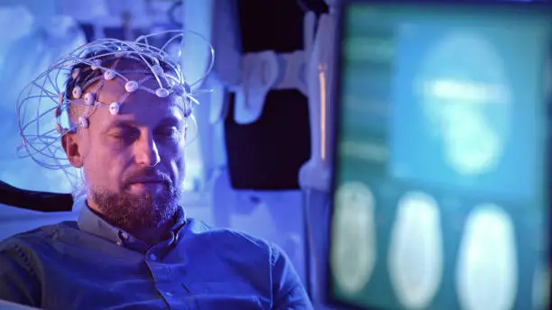 In modern Neurological Research Laboratory. EEG animation on monitor screen.